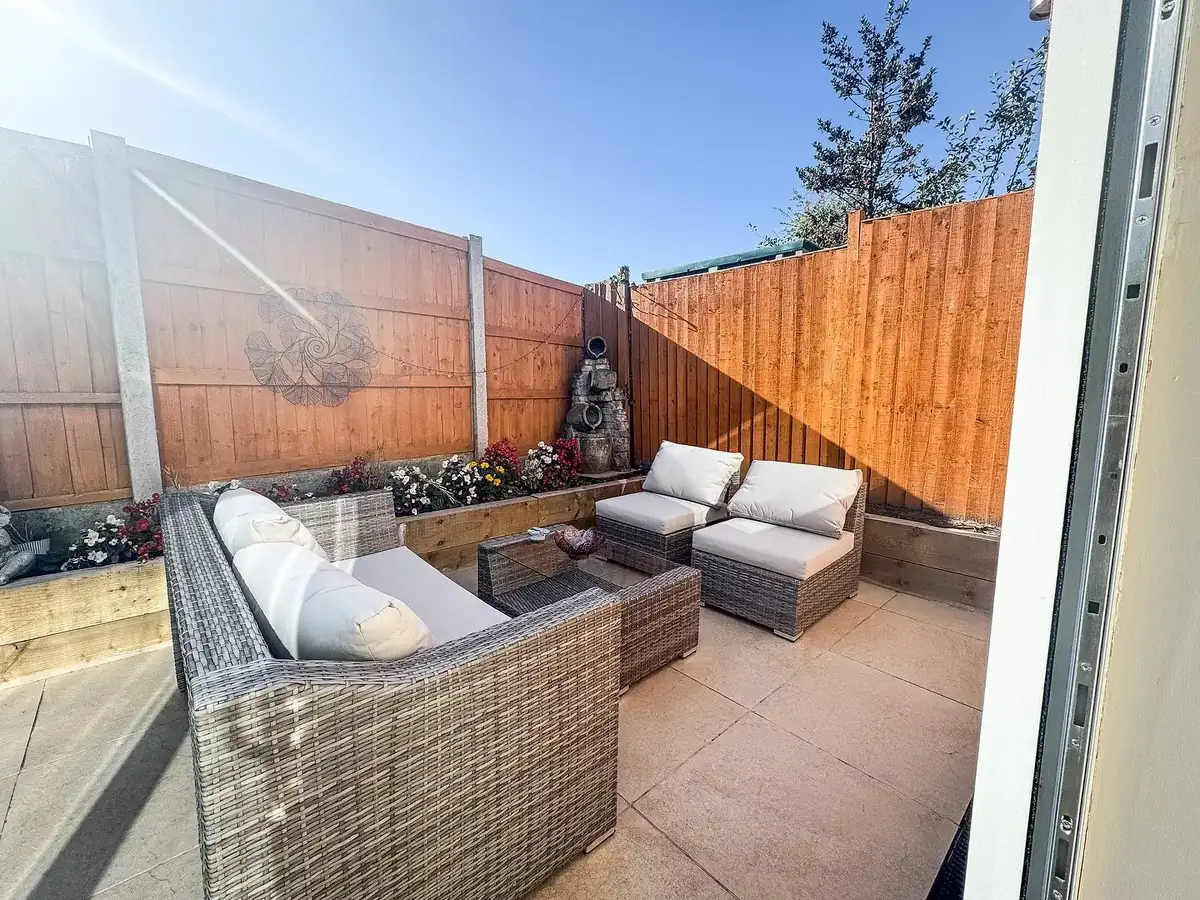 Paved patio and seating area finished with new close-board fencing