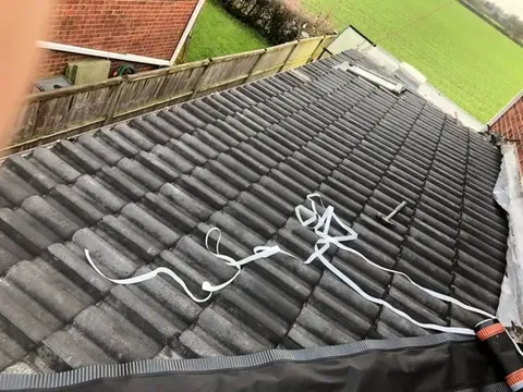 Close view of newly laid roof tiles on a completed extension