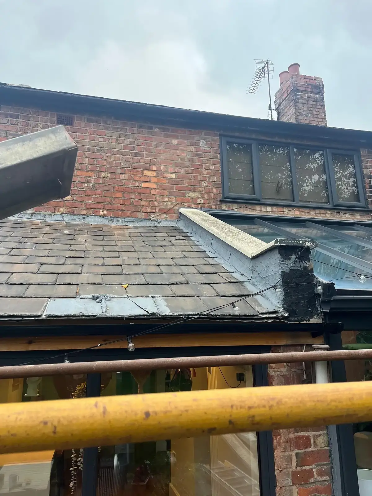 Roof edge with new rooflights installed, viewed from the scaffold