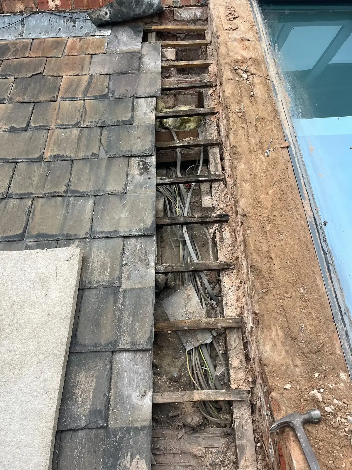 Old slate roof cut back to receive a new glazed roof lantern